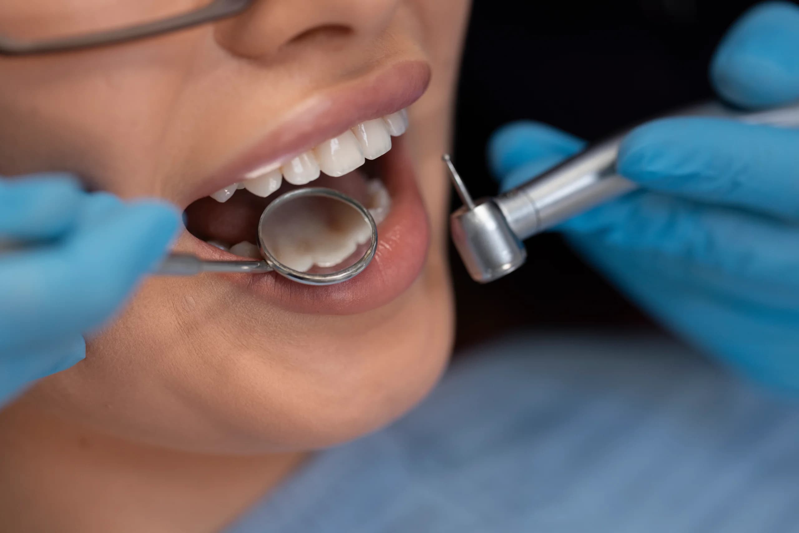 Dentist using instruments during treatment